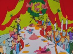 Picture of the grinch and who\'s from whoville eating Christmas supper.